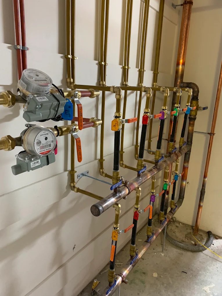 Copper and brass water service board, every line tagged and labelled